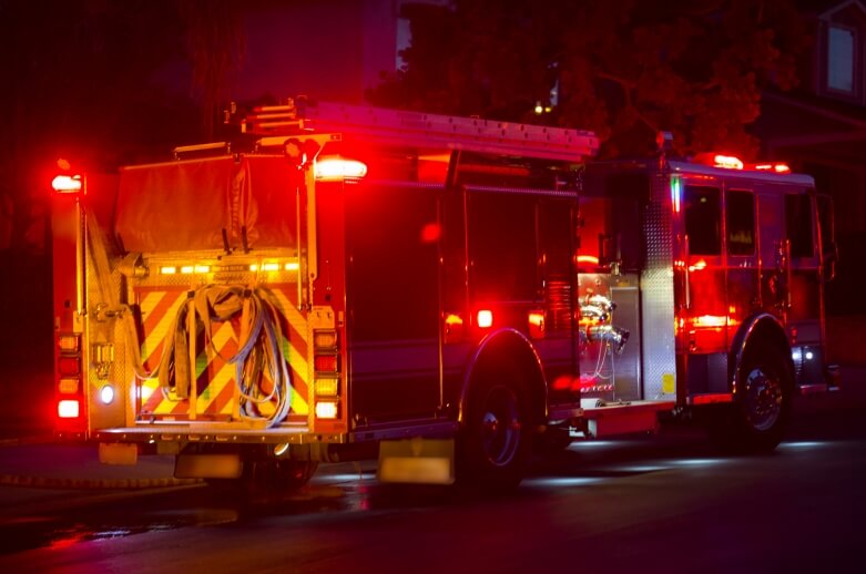 A fire engine at night at an emergency