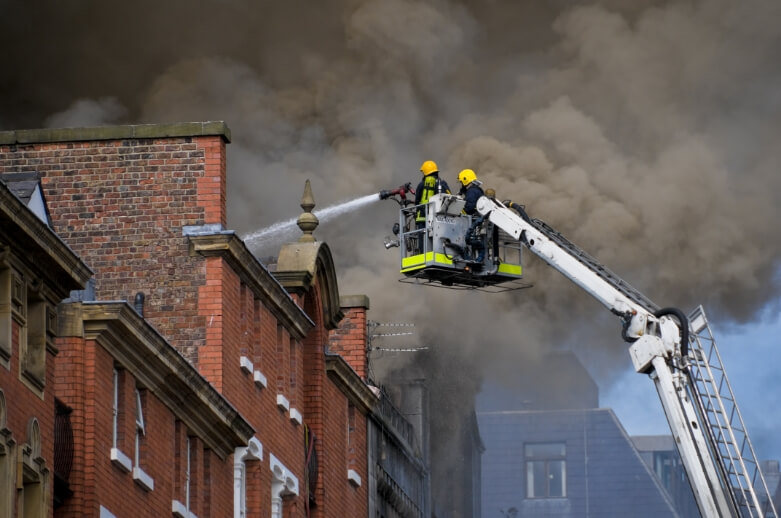 Firefighters putting out a house fire