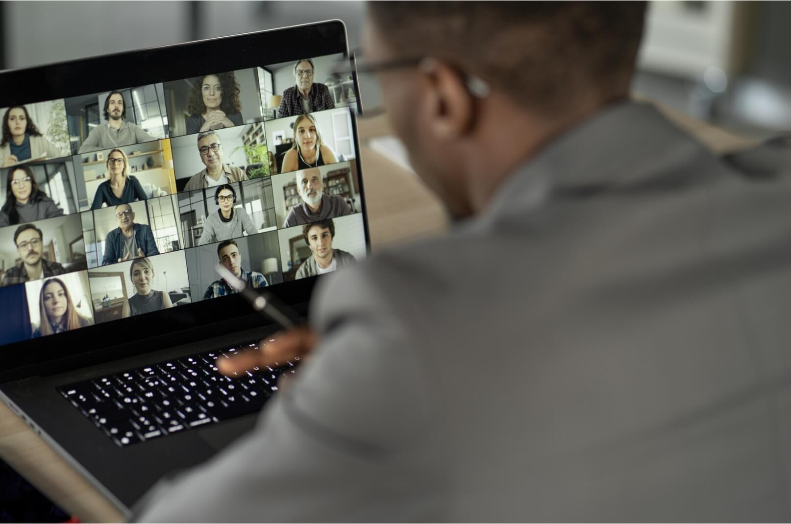 Man on video call with multiple people