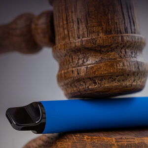 A judge mallet hitting a vape